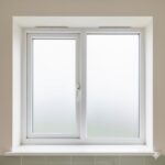 Brilliant white two-part uPVC tilt-and-turn window installed in traditional Dublin kitchen — interior view — Dublin Blinds